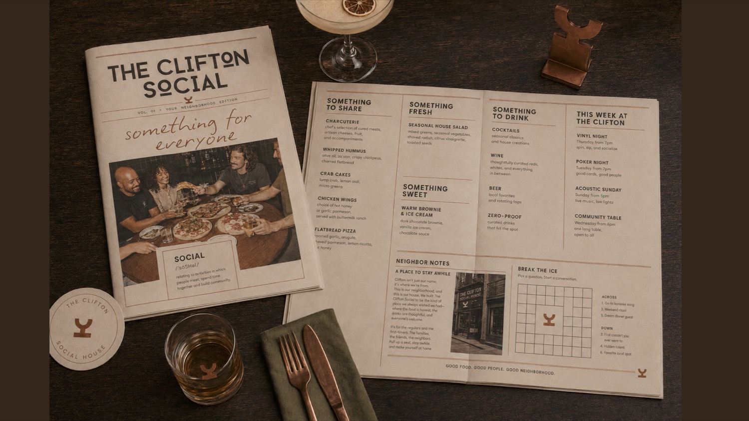 The Clifton Social menu and printed materials on a table